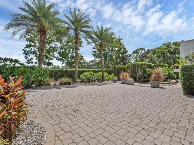 an aerial view of residential houses with outdoor space and river