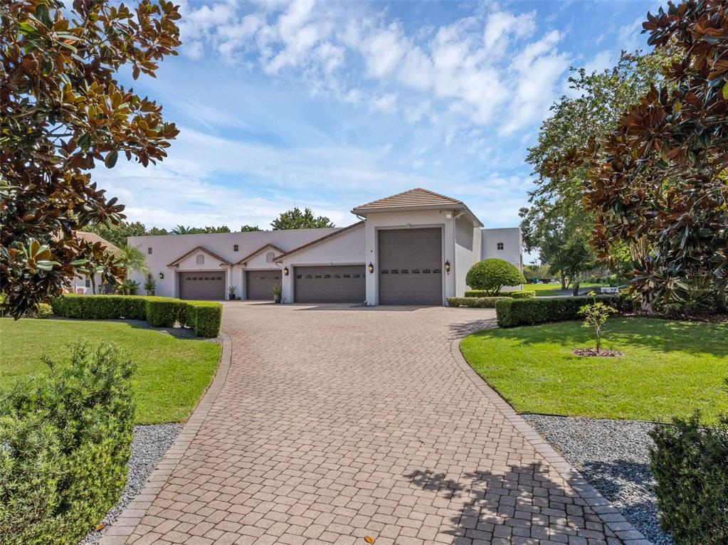 919 Banana Lake Road Lake Mary, FL 32746 - Photo 54 of 76 a front view of a house with garden
