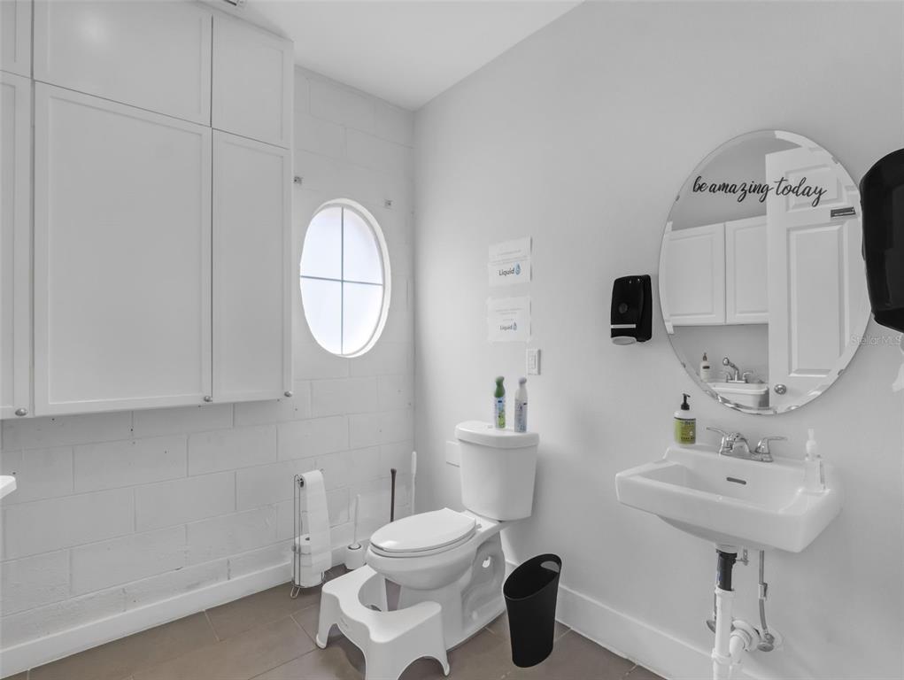 919 Banana Lake Road Lake Mary, FL 32746 - Photo 57 of 76 a bathroom with a toilet sink and mirror