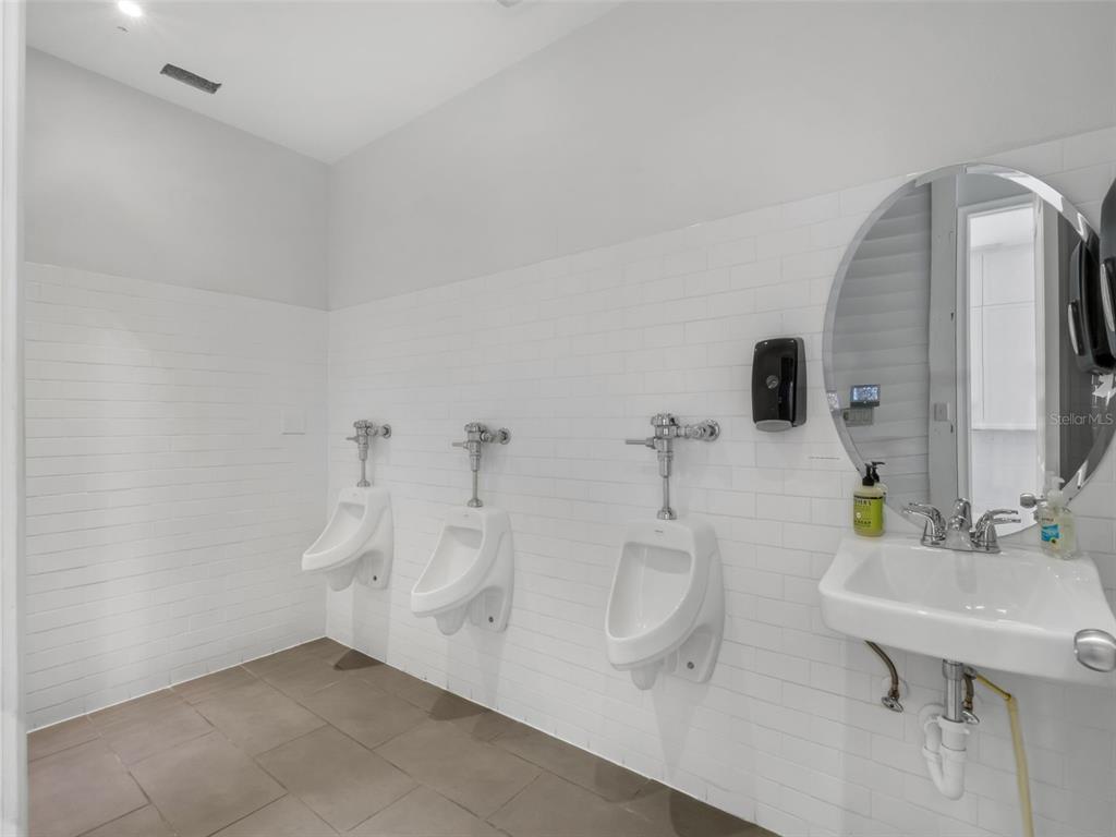 919 Banana Lake Road Lake Mary, FL 32746 - Photo 58 of 76 a bathroom with a sink a toilet and mirror