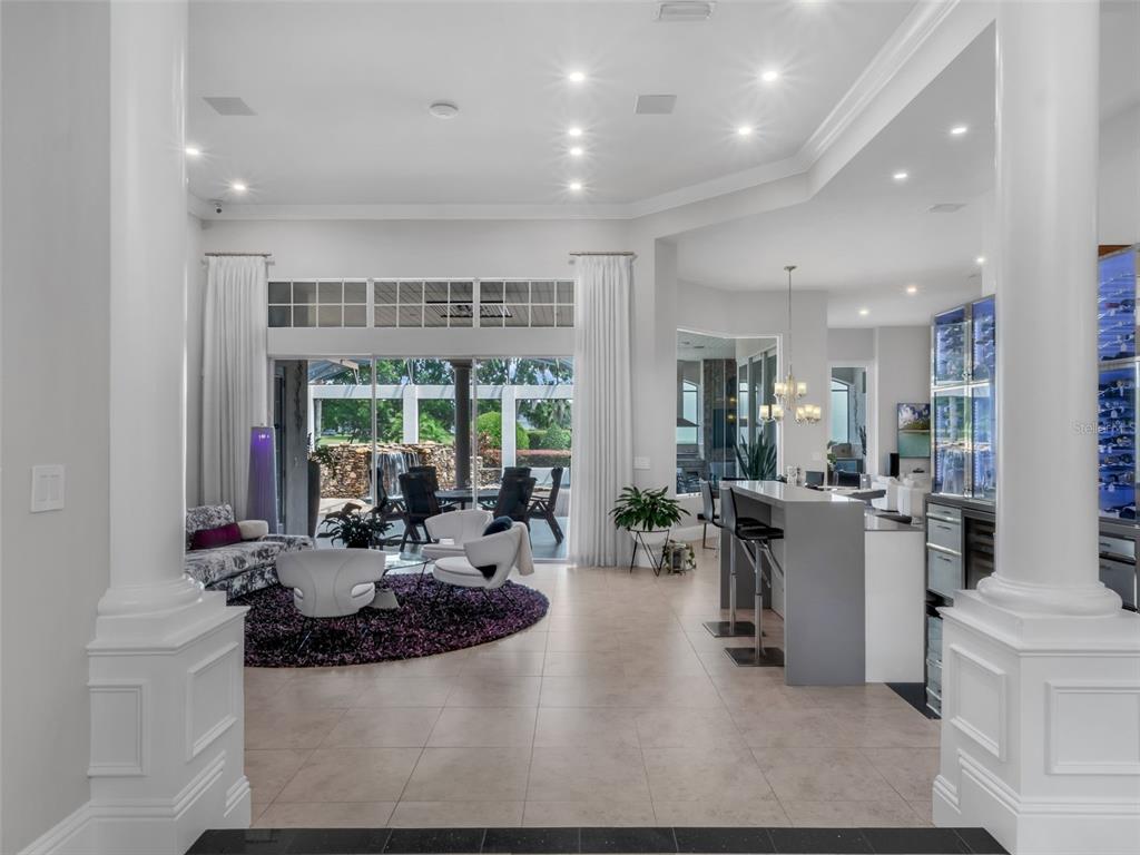919 Banana Lake Road Lake Mary, FL 32746 - Photo 7 of 76 a very nice looking living room with a large window and dining table