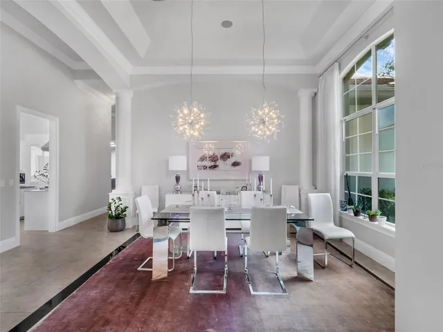 a living room with furniture appliances and a view