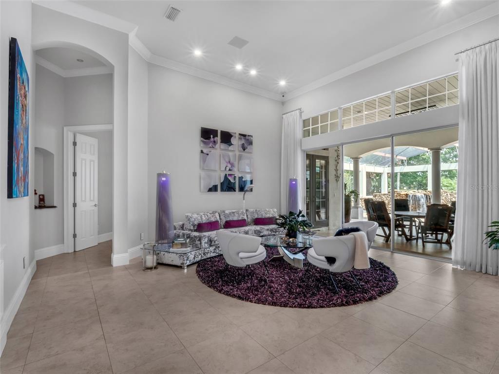 919 Banana Lake Road Lake Mary, FL 32746 - Photo 9 of 76 a living room with furniture and a large window