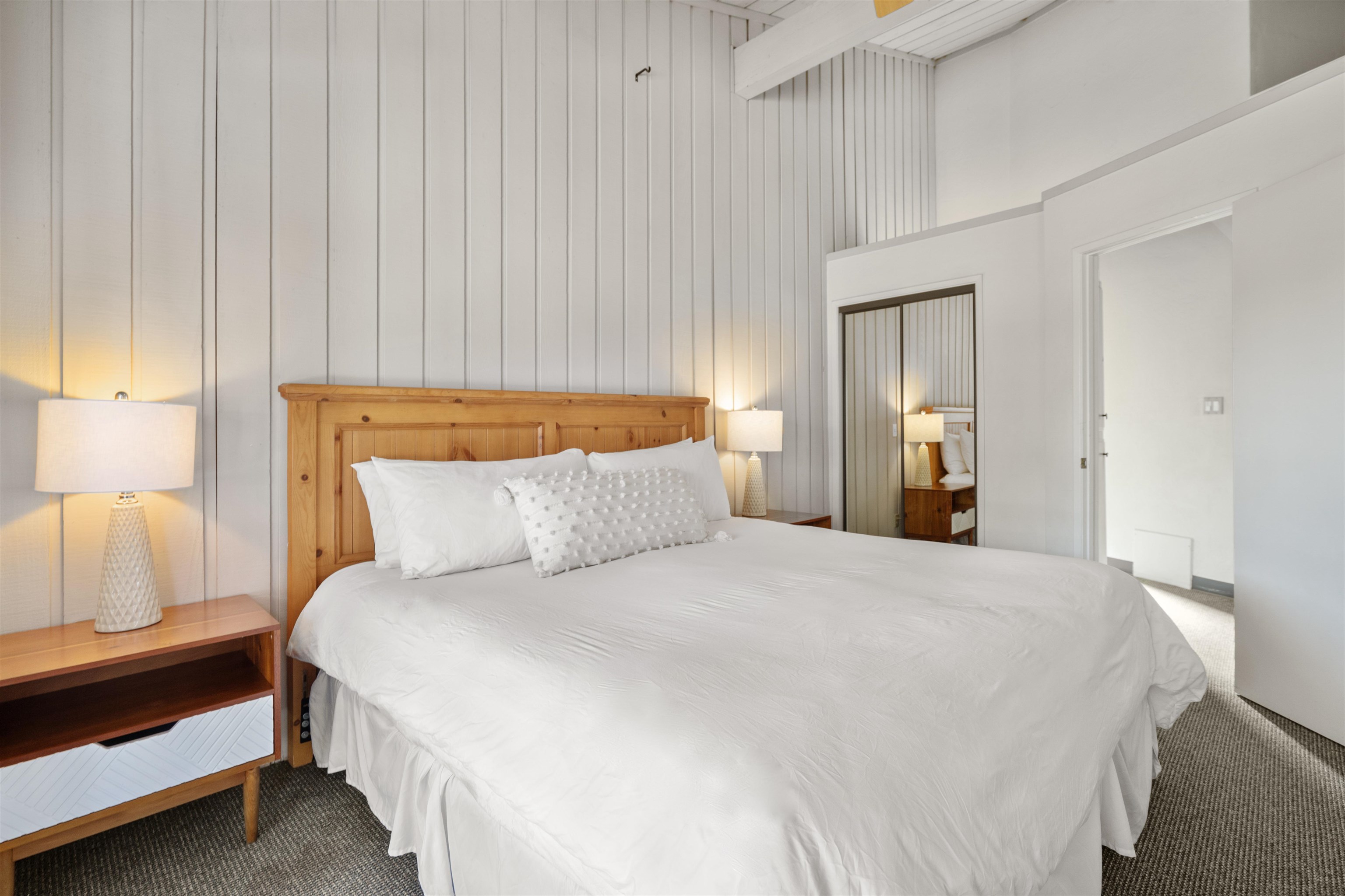 286 Old Mammoth Road, Unit 80 Mammoth Lakes, CA 93546 - Photo 7 of 19 a bedroom with a bed and a night stand