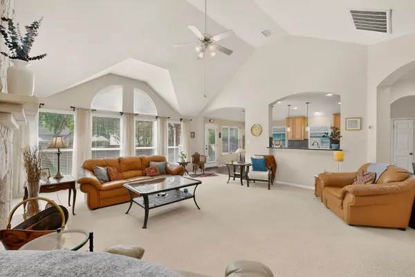 a living room with furniture and a large window
