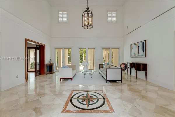a living room with kitchen island furniture and a large window