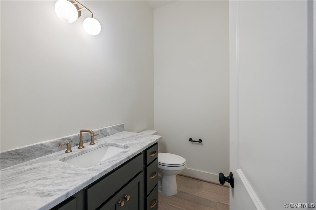 1558 Smokey Ridge Road Maidens, VA 23102 - Photo 16 of 43 a bathroom with a granite countertop toilet and sink