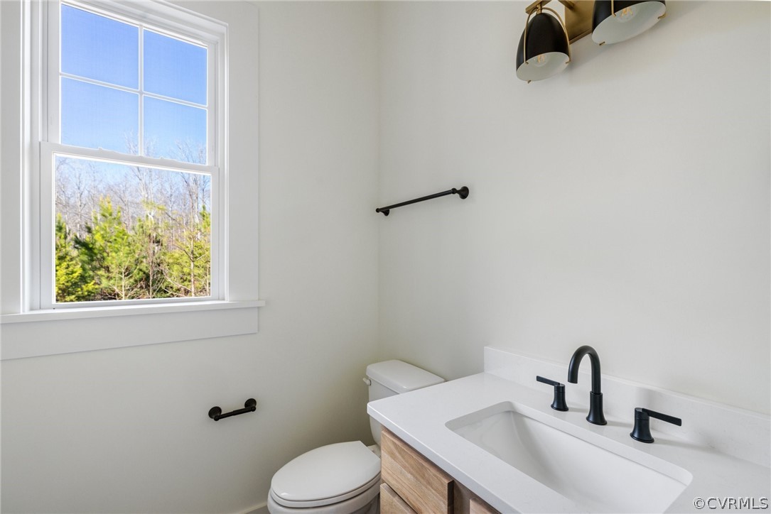 1558 Smokey Ridge Road Maidens, VA 23102 - Photo 18 of 43 a bathroom with a sink and a toilet