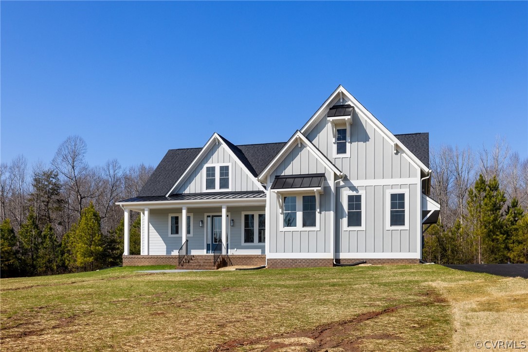 1558 Smokey Ridge Road Maidens, VA 23102 - Photo 2 of 43 a front view of a house with a yard