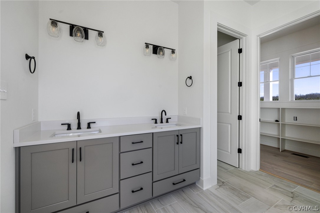 1558 Smokey Ridge Road Maidens, VA 23102 - Photo 22 of 43 a spacious bathroom with a double vanity sink a mirror and shower