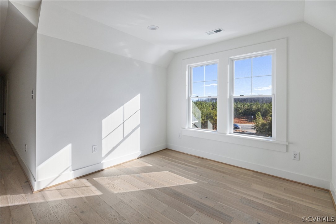 1558 Smokey Ridge Road Maidens, VA 23102 - Photo 29 of 43 an empty room with wooden floor and windows