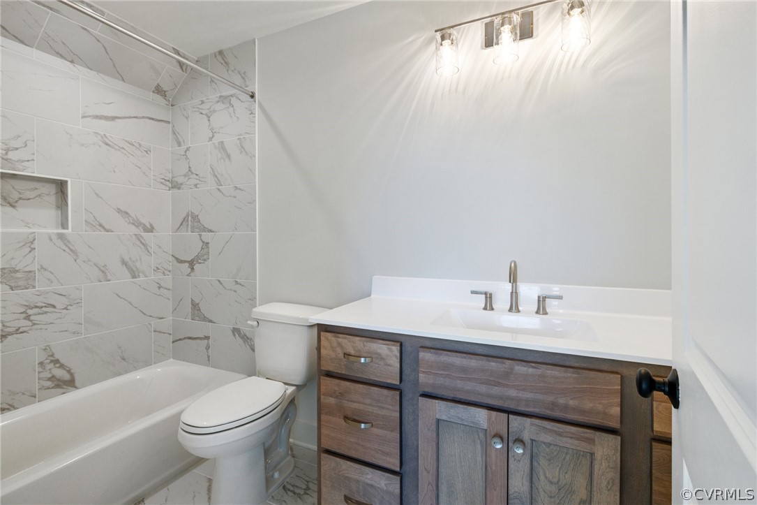 1558 Smokey Ridge Road Maidens, VA 23102 - Photo 31 of 43 a bathroom with a sink a toilet and shower