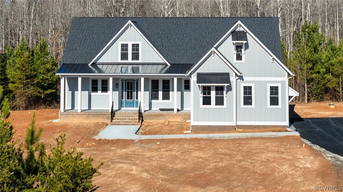1558 Smokey Ridge Road Maidens, VA 23102 - Photo 35 of 43 a front view of a house with a yard
