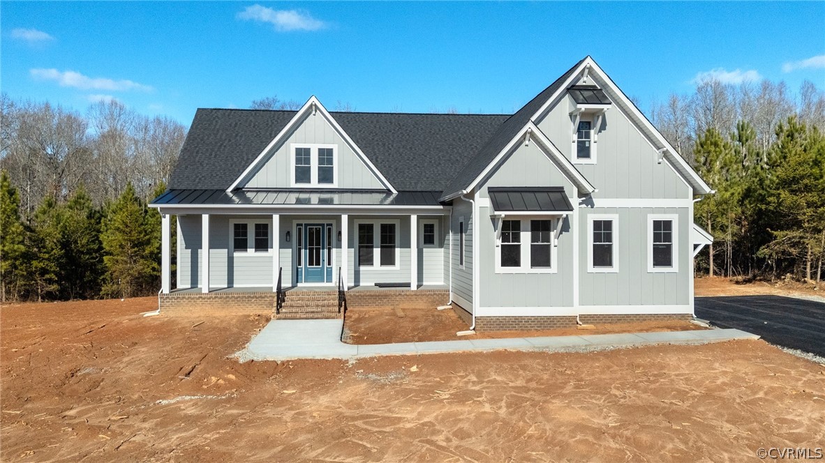 1558 Smokey Ridge Road Maidens, VA 23102 - Photo 37 of 43 a front view of a house with a garden