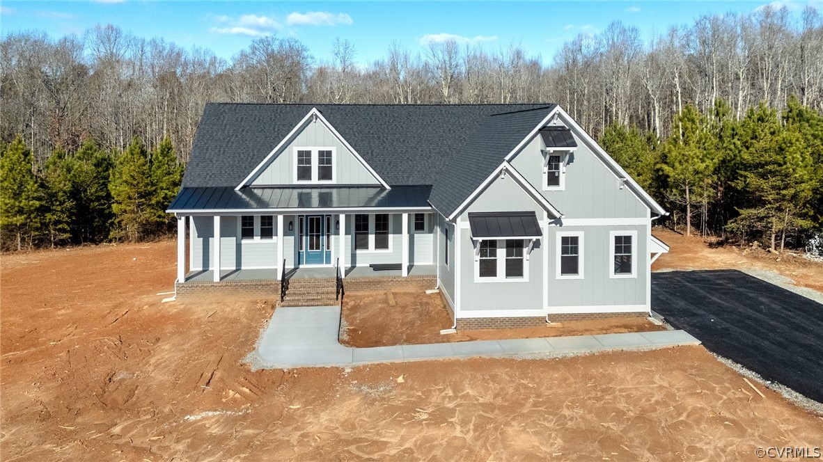 1558 Smokey Ridge Road Maidens, VA 23102 - Photo 39 of 43 a house with trees in the background