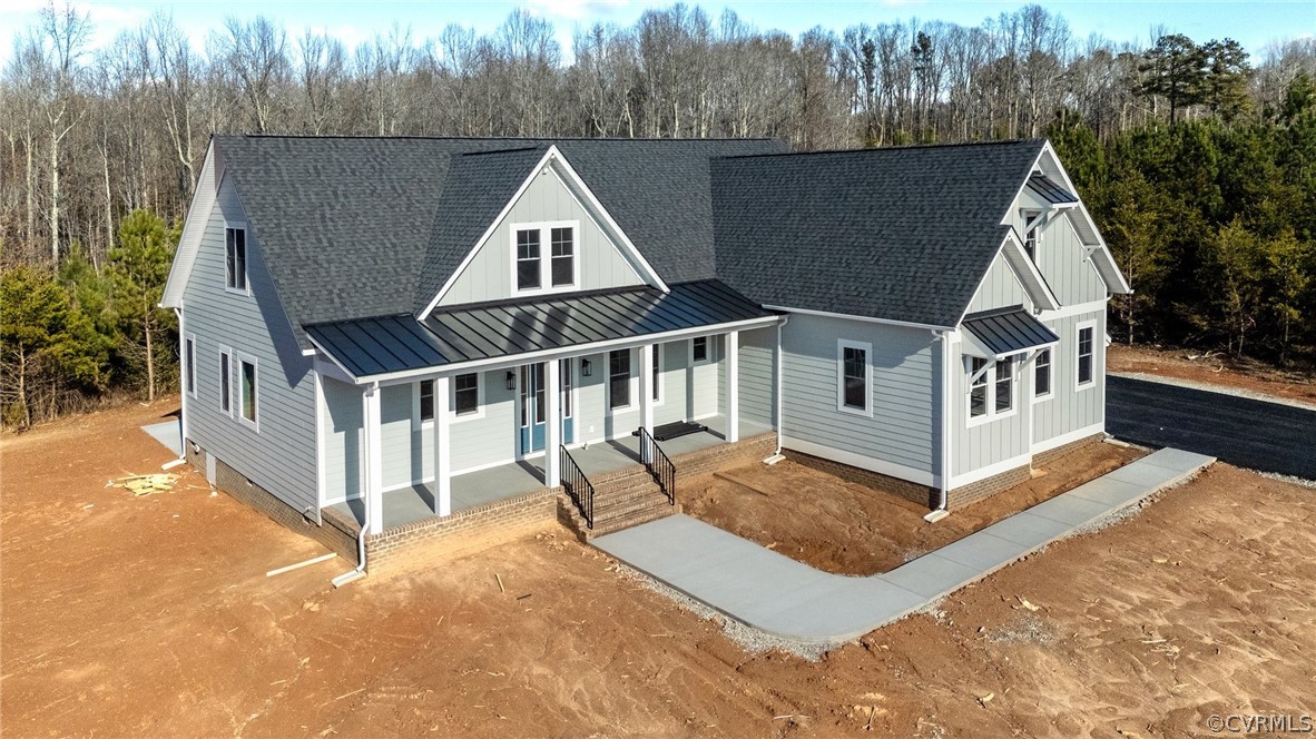 1558 Smokey Ridge Road Maidens, VA 23102 - Photo 40 of 43 a view of house with yard and trees in the background