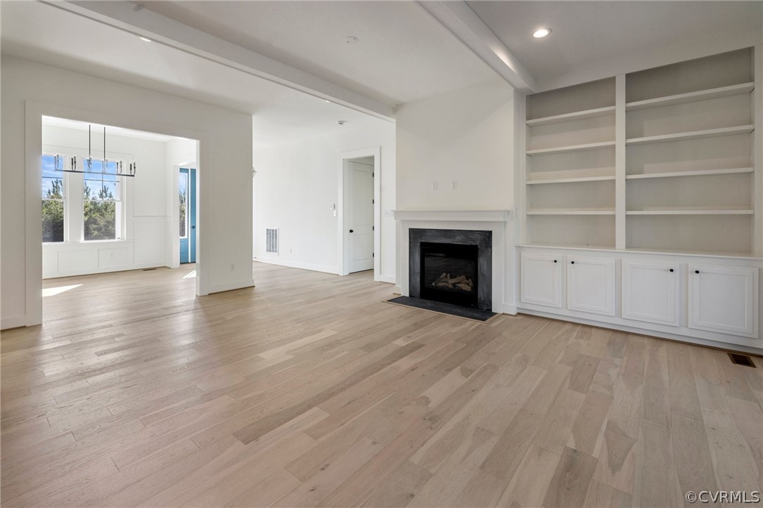 1558 Smokey Ridge Road Maidens, VA 23102 - Photo 8 of 43 a view of an empty room with a fireplace and a window