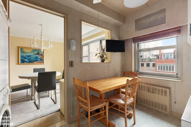 a kitchen with stainless steel appliances granite countertop a refrigerator and a stove