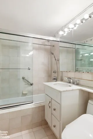 a bedroom with a large bed and a large window