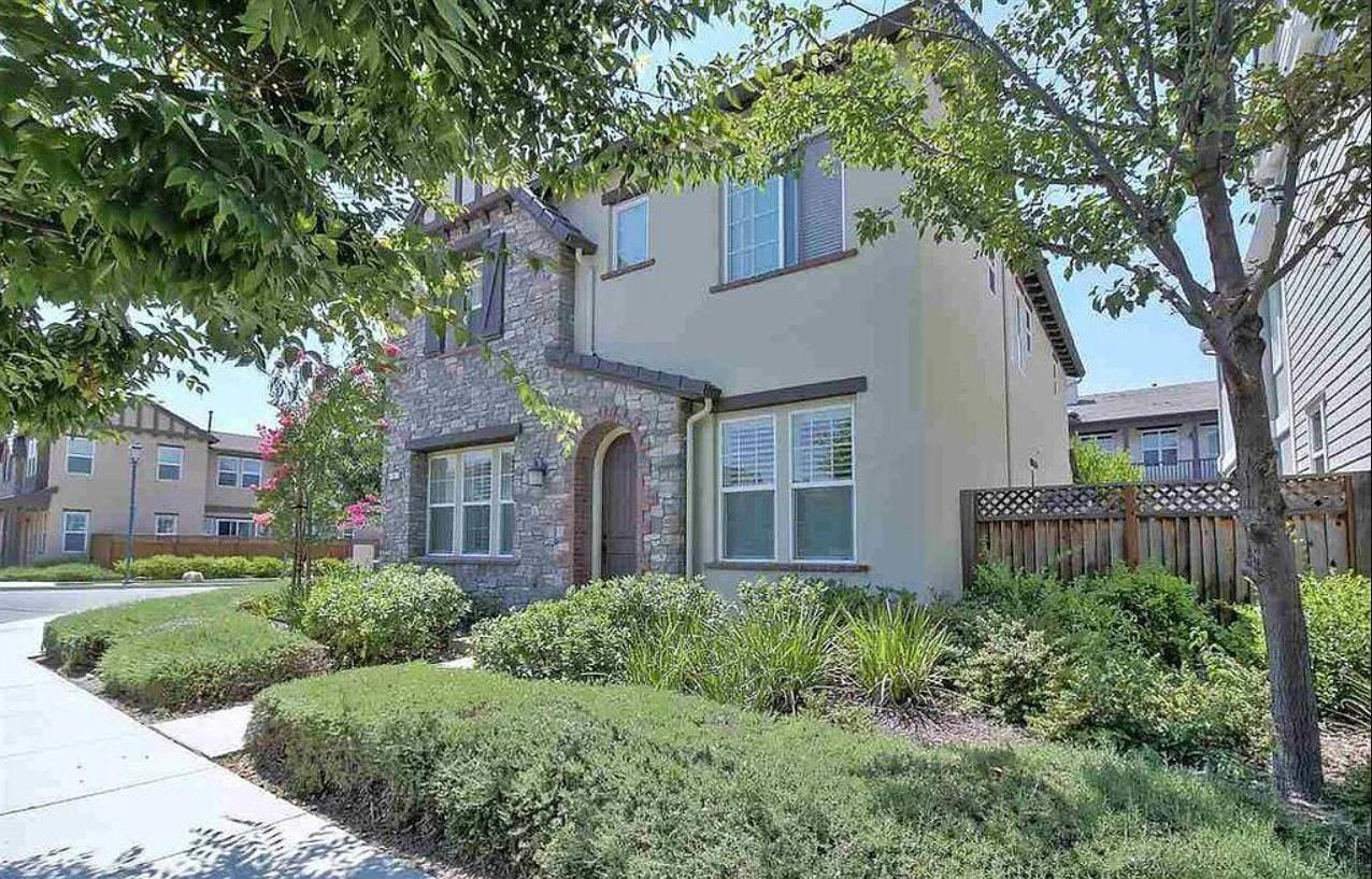 4701 Malayan Street San Ramon, CA 94582 - Photo 2 of 15 a front view of a house with a yard and potted plants