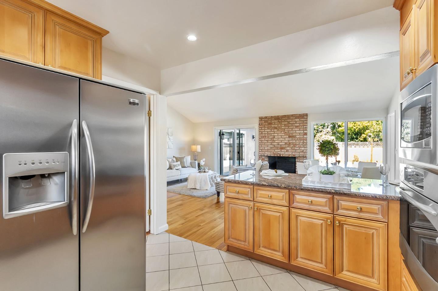 1051 Suffolk Way Los Altos, CA 94024 - Photo 17 of 47 a kitchen with stainless steel appliances granite countertop a refrigerator and a sink