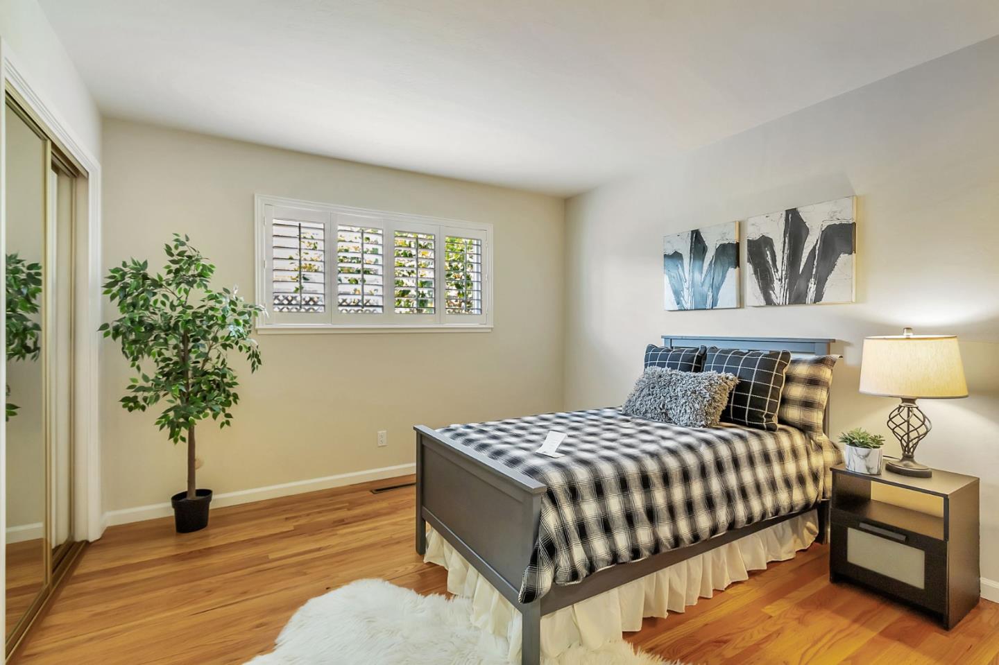1051 Suffolk Way Los Altos, CA 94024 - Photo 26 of 47 a bedroom with a bed and a potted plant