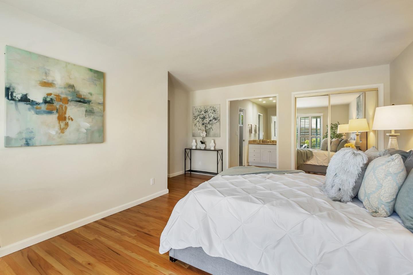 1051 Suffolk Way Los Altos, CA 94024 - Photo 29 of 47 a bedroom with a large bed and wooden floor