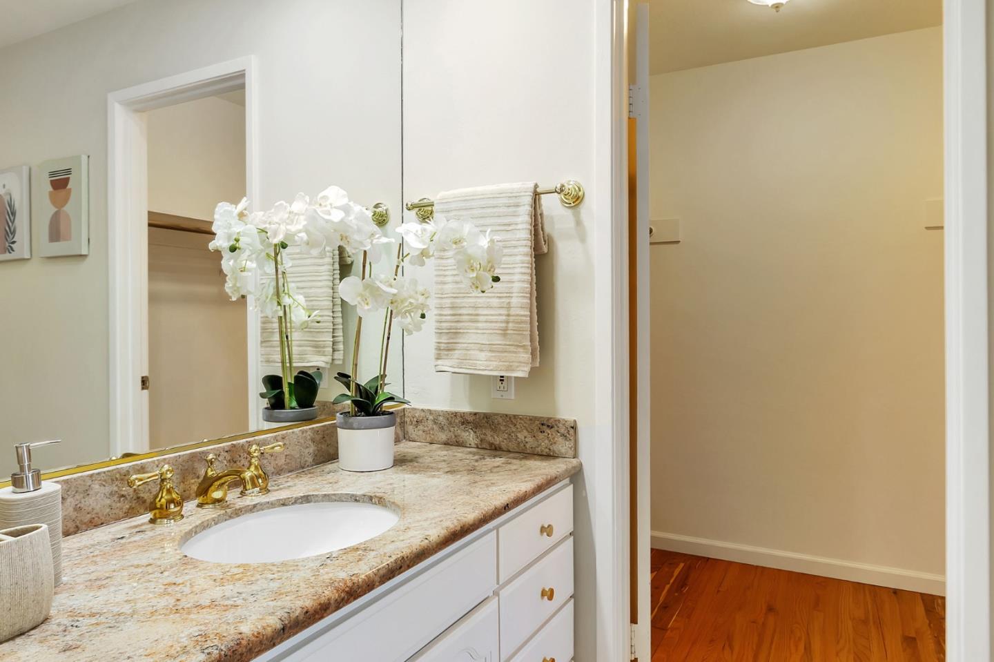1051 Suffolk Way Los Altos, CA 94024 - Photo 34 of 47 a bathroom with a granite countertop sink and a mirror