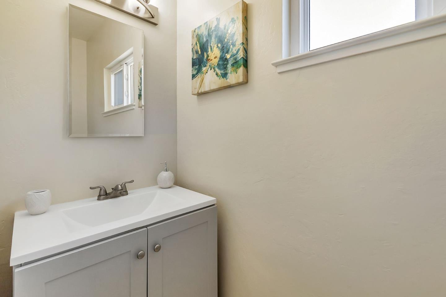 1051 Suffolk Way Los Altos, CA 94024 - Photo 38 of 47 a bathroom with a sink and a mirror
