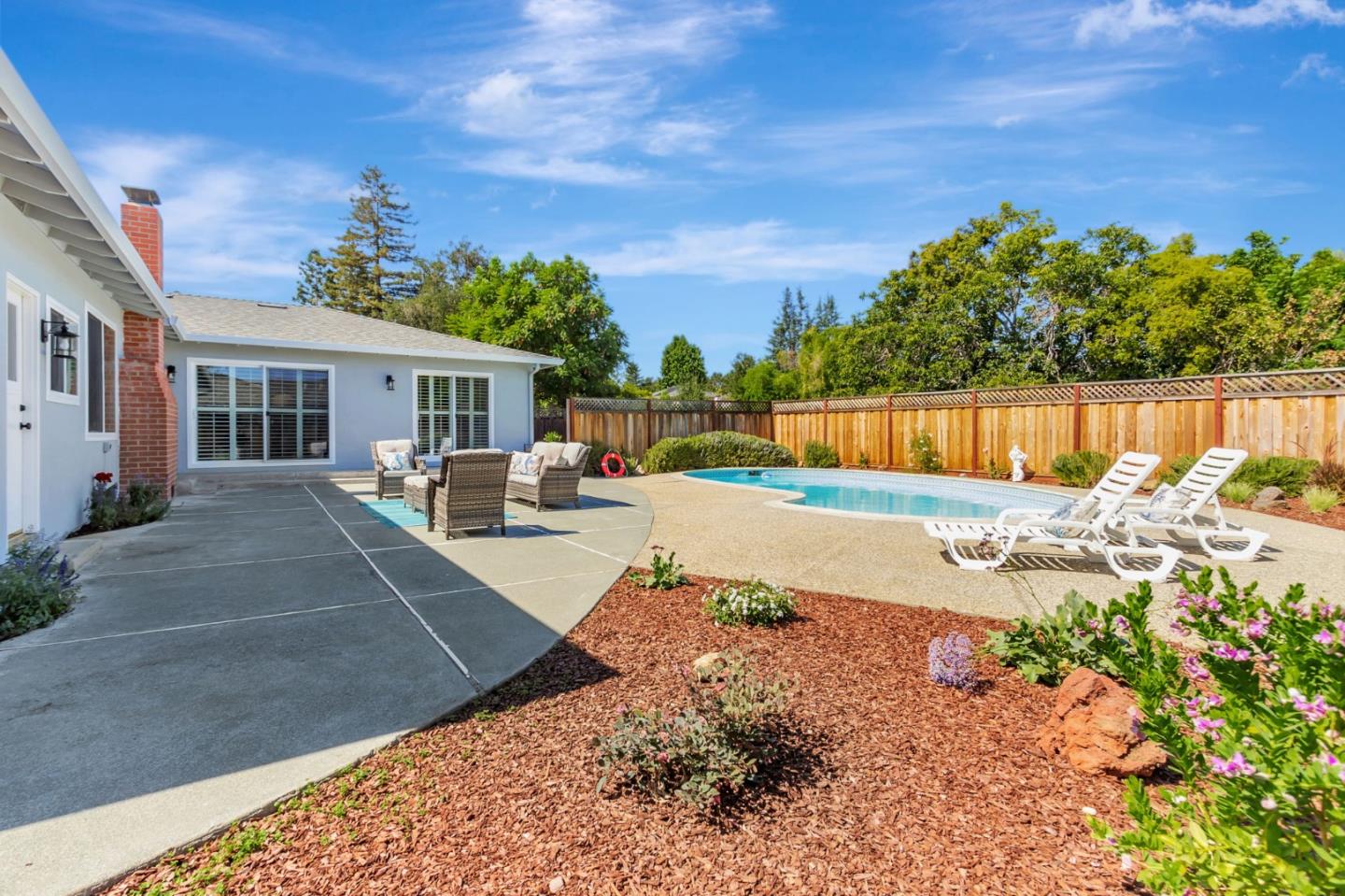 1051 Suffolk Way Los Altos, CA 94024 - Photo 44 of 47 a view of a house with swimming pool and a yard