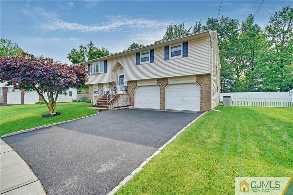 21 Louise Road Edison, NJ 08817 - Photo 1 of 29 a view of a house with a yard