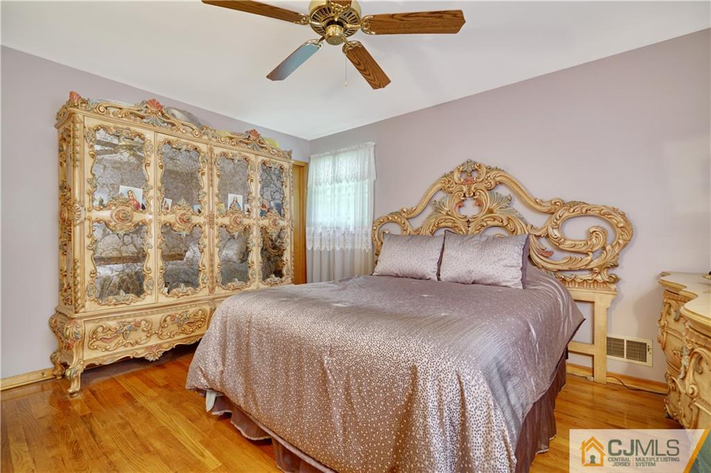 21 Louise Road Edison, NJ 08817 - Photo 13 of 29 a bedroom with a bed and a window