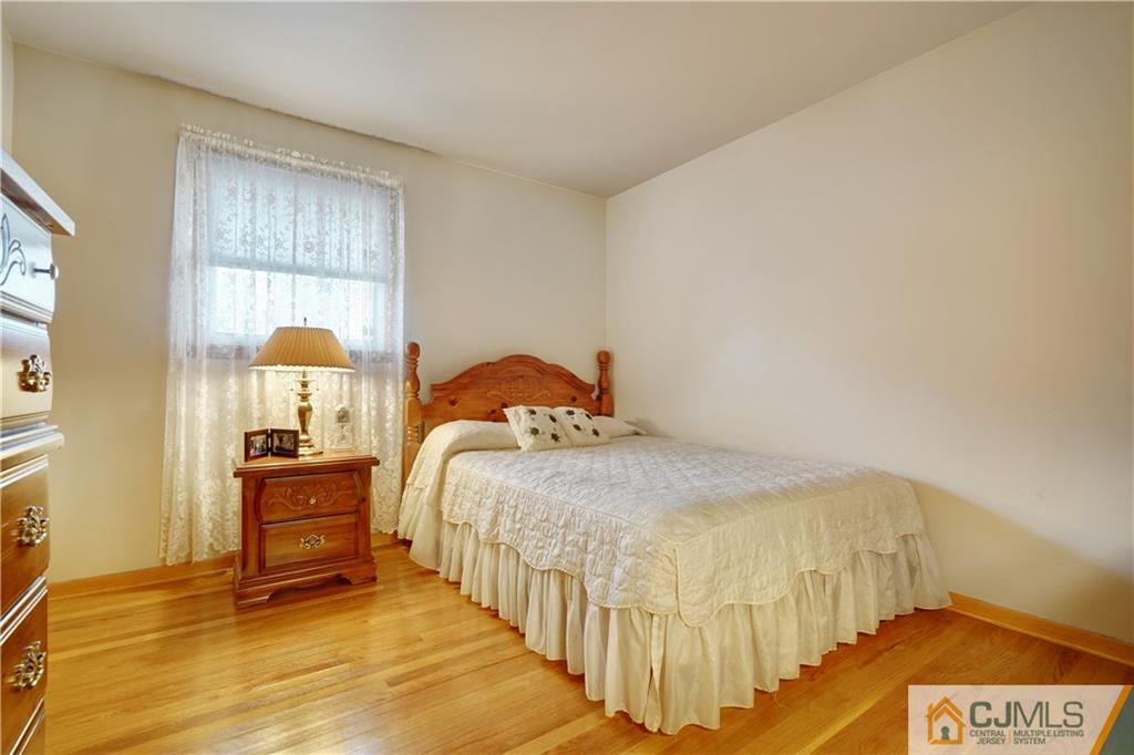 21 Louise Road Edison, NJ 08817 - Photo 15 of 29 a bedroom with a bed and a window