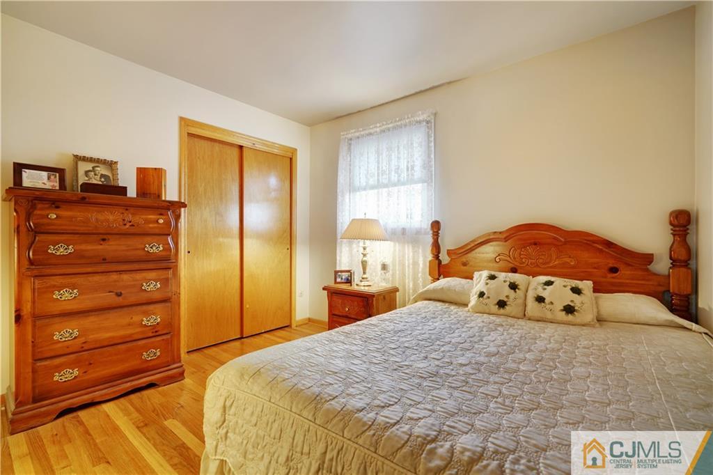 21 Louise Road Edison, NJ 08817 - Photo 16 of 29 a bedroom with a bed and a window