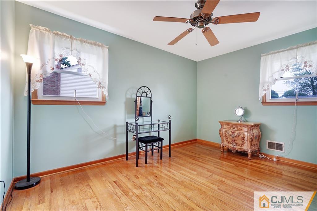 21 Louise Road Edison, NJ 08817 - Photo 17 of 29 a work room with furniture and a chandelier