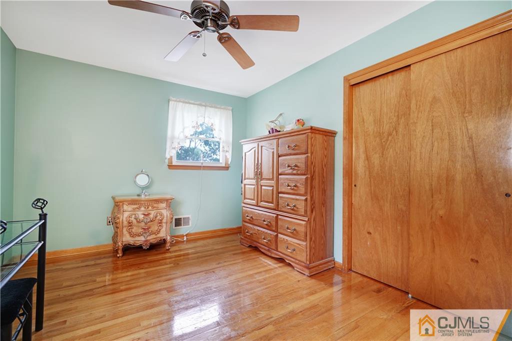 21 Louise Road Edison, NJ 08817 - Photo 18 of 29 a living room with furniture and a wooden floor