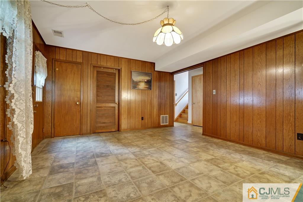 21 Louise Road Edison, NJ 08817 - Photo 21 of 29 a view of a livingroom with a chandelier