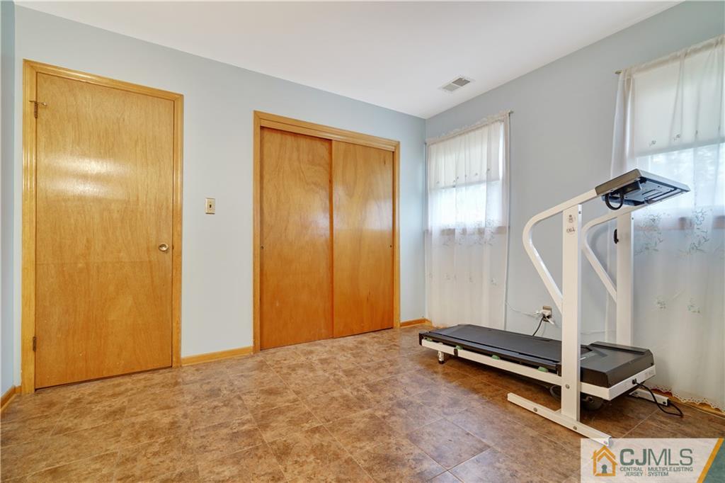 21 Louise Road Edison, NJ 08817 - Photo 22 of 29 a view of a room with gym equipment
