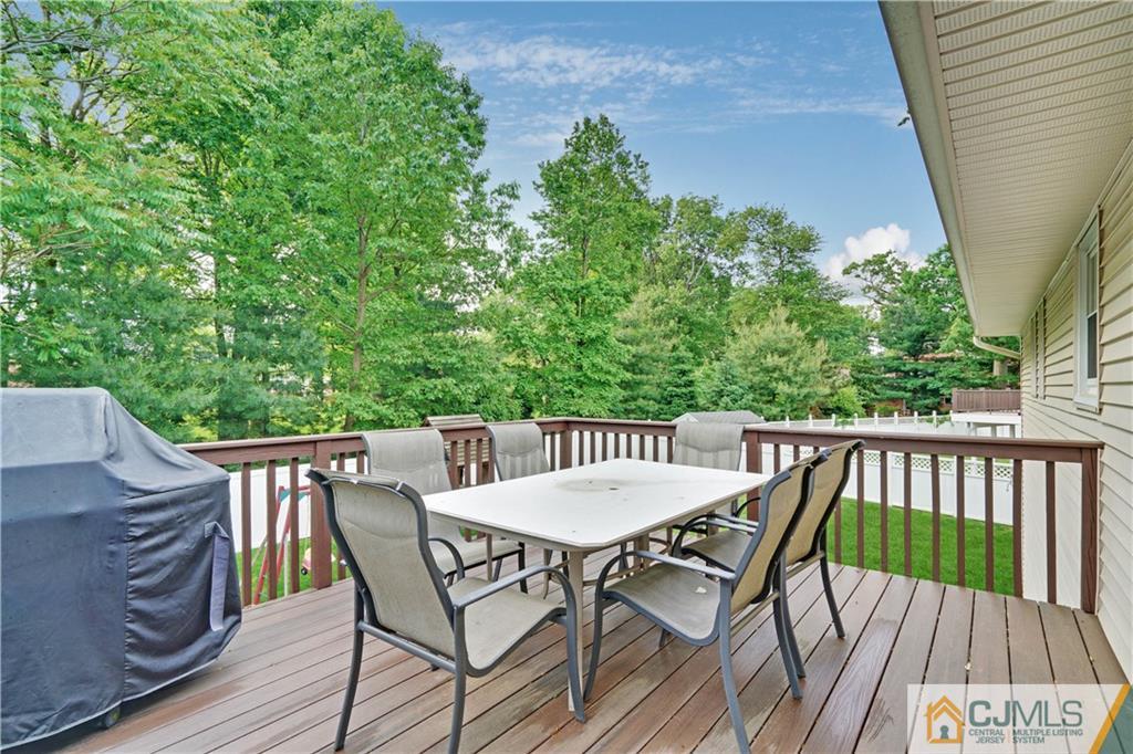 21 Louise Road Edison, NJ 08817 - Photo 25 of 29 a view of a table and chairs in the balcony