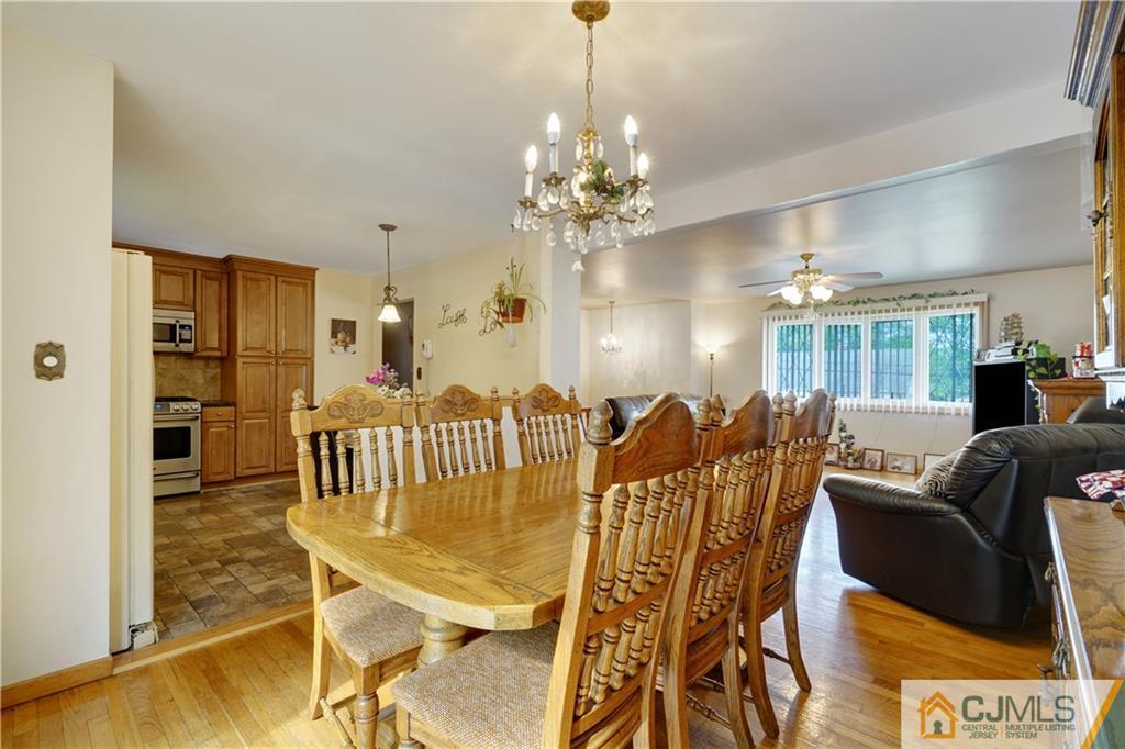 21 Louise Road Edison, NJ 08817 - Photo 7 of 29 a view of a dining room with furniture and chandelier