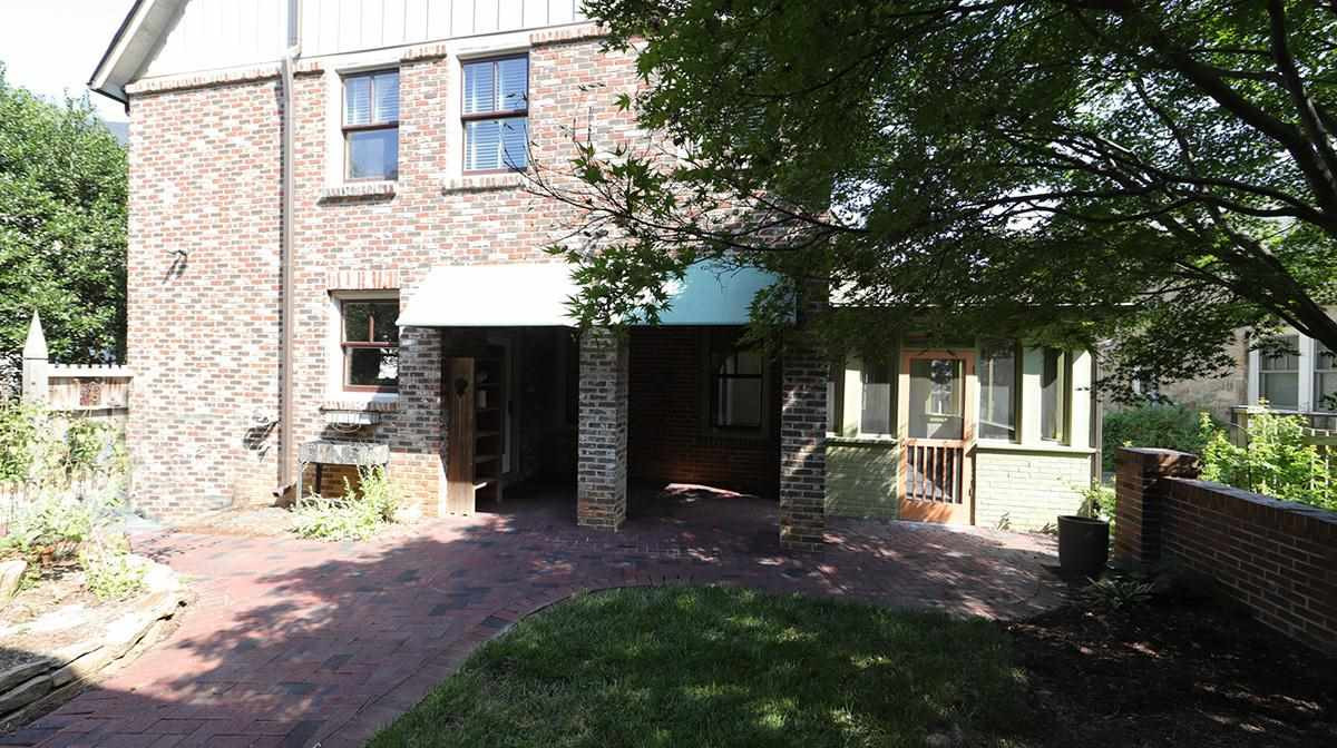 2308 Byrd Street Raleigh, NC 27608 - Photo 30 of 30 Covered Back Porch with brick patio, wonderful shade trees and even a terrific chicken coop to the left. Exterior Back
