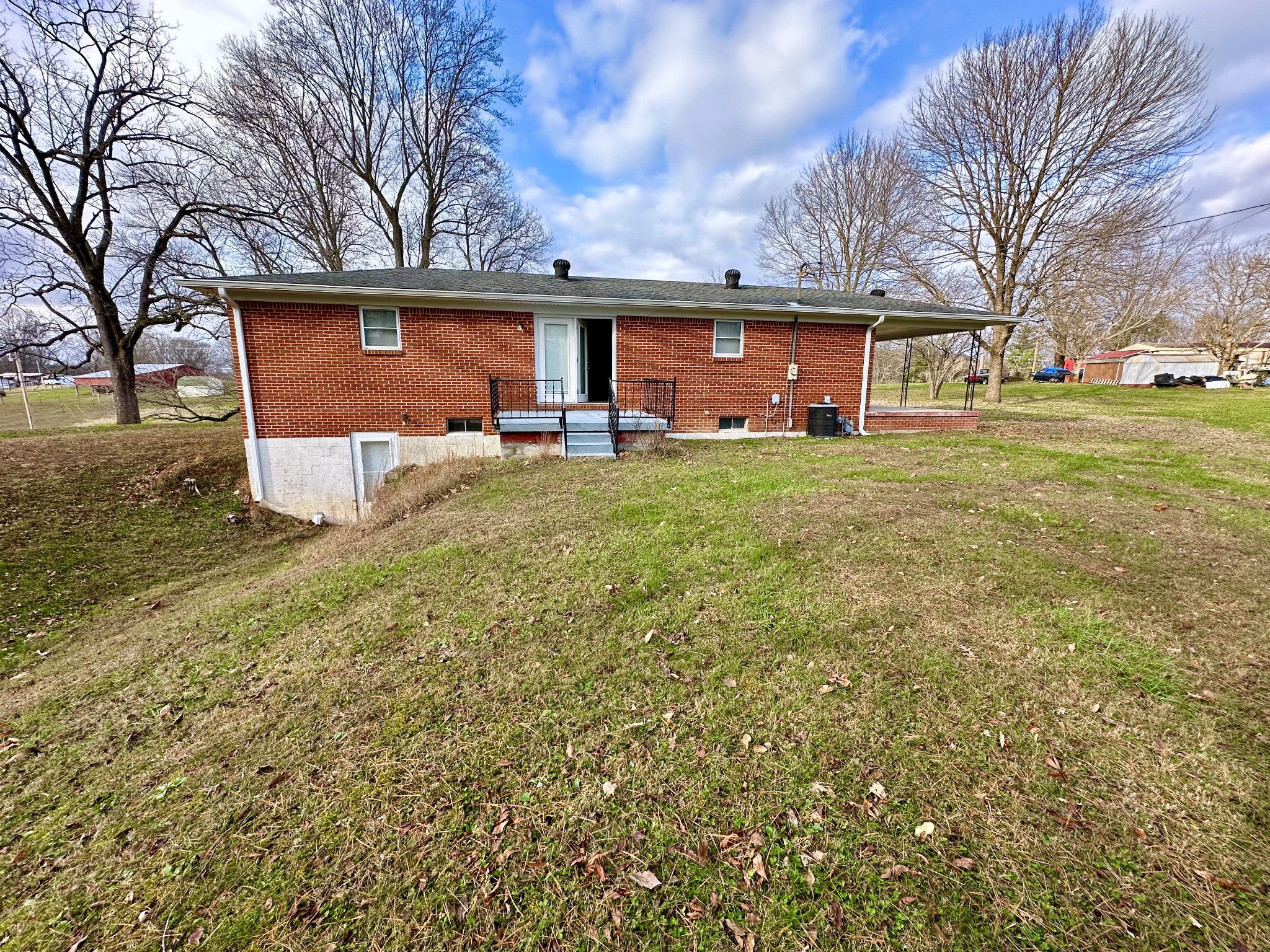 329 Poplar Drive Red Boiling Springs, TN 37150 - Photo 13 of 15 a view of a house with a yard