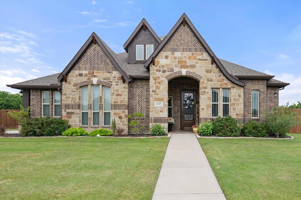 445 Rusty Run Drive Midlothian, TX 76065 - Photo 1 of 40 a front view of a house with garden