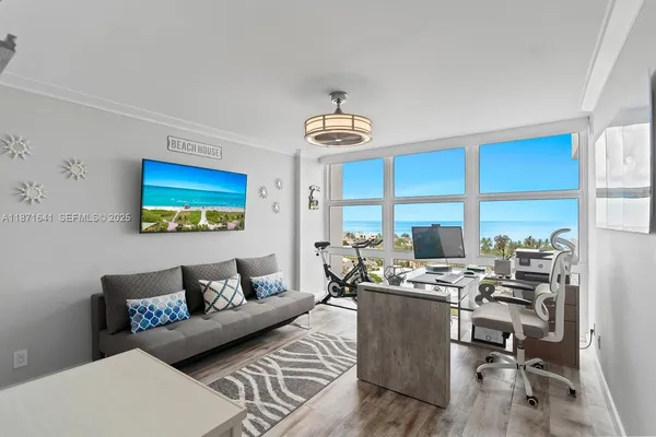 a view of roof with furniture and city view