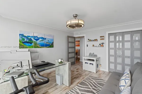 a room with a table chairs and entryway