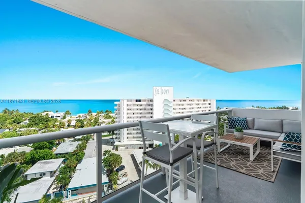 a view of a balcony with an outdoor space