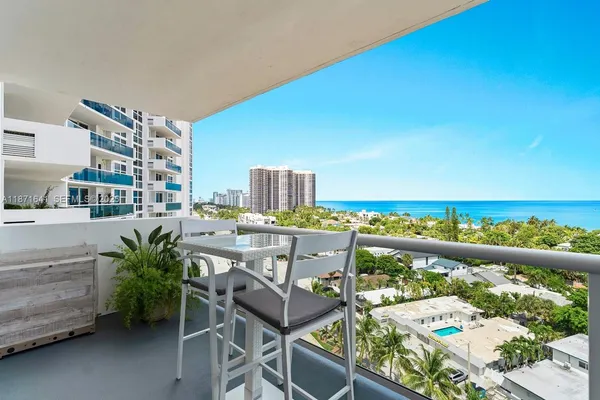 a view of a balcony with furniture