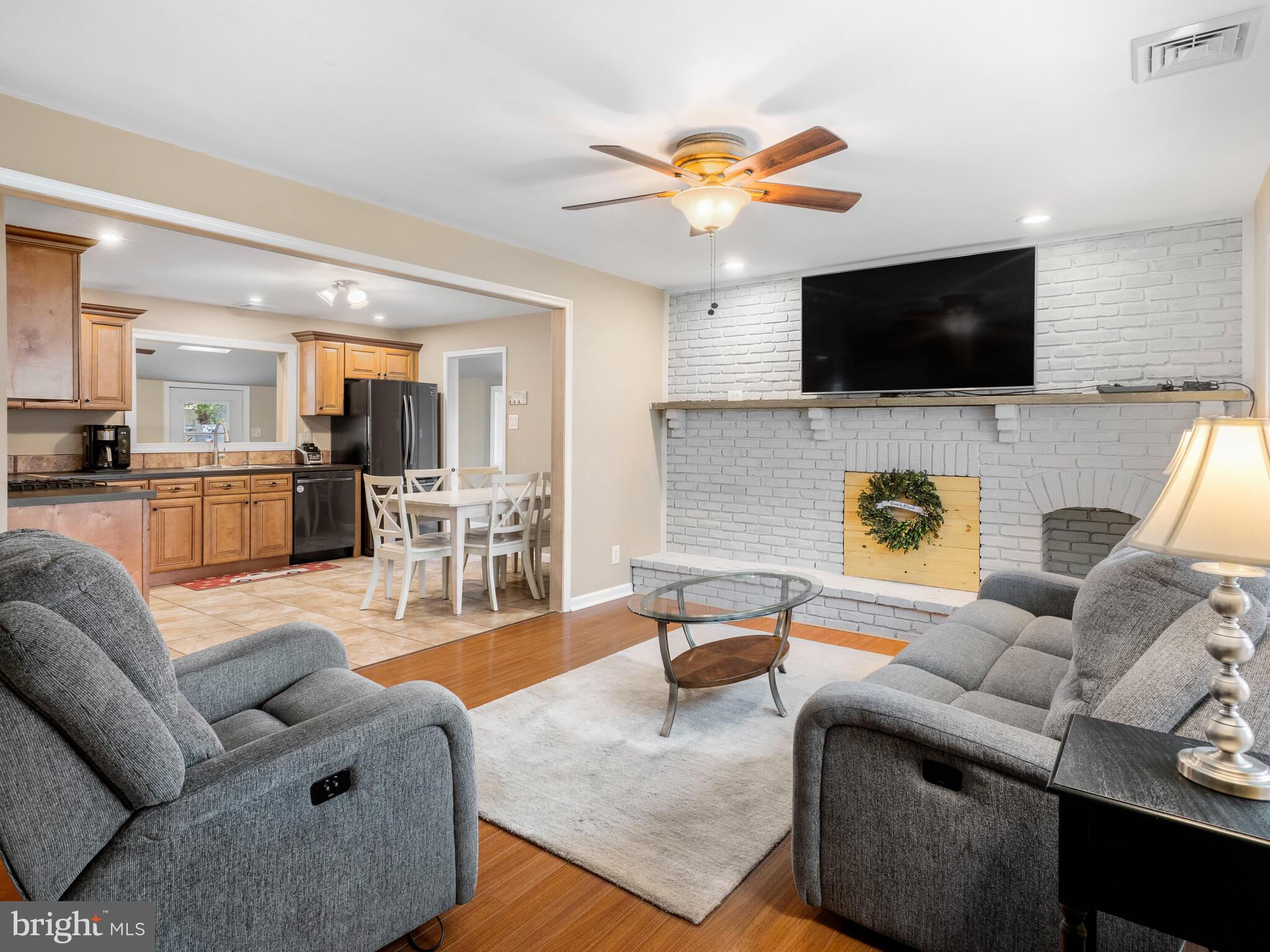2631 Wood Road Secane, PA 19018 - Photo 7 of 32 Living Room w/ brick fireplace & hearth