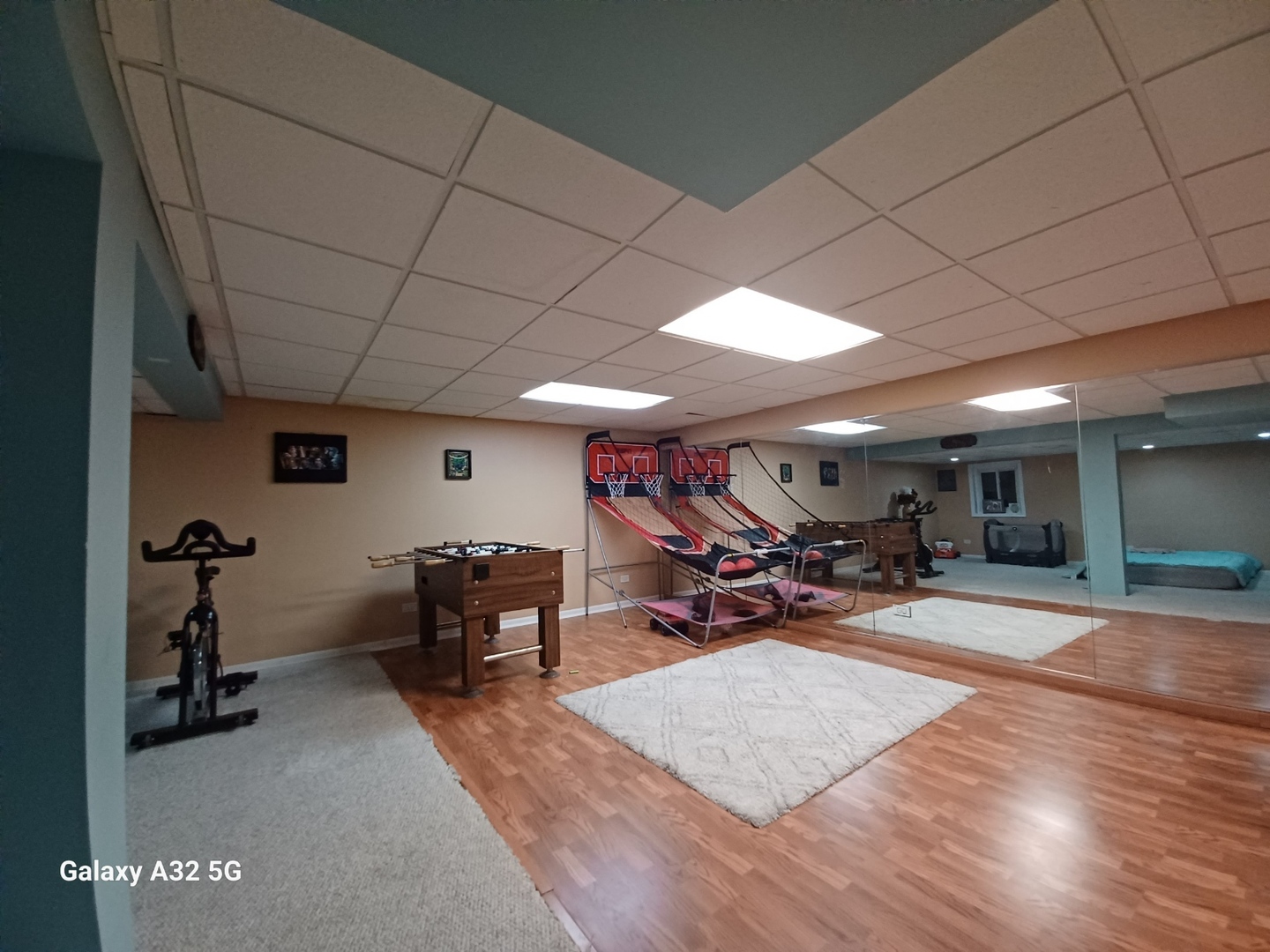 90 Decker Drive Cary, IL 60013 - Photo 11 of 12 a view of a big room with furniture and a garage