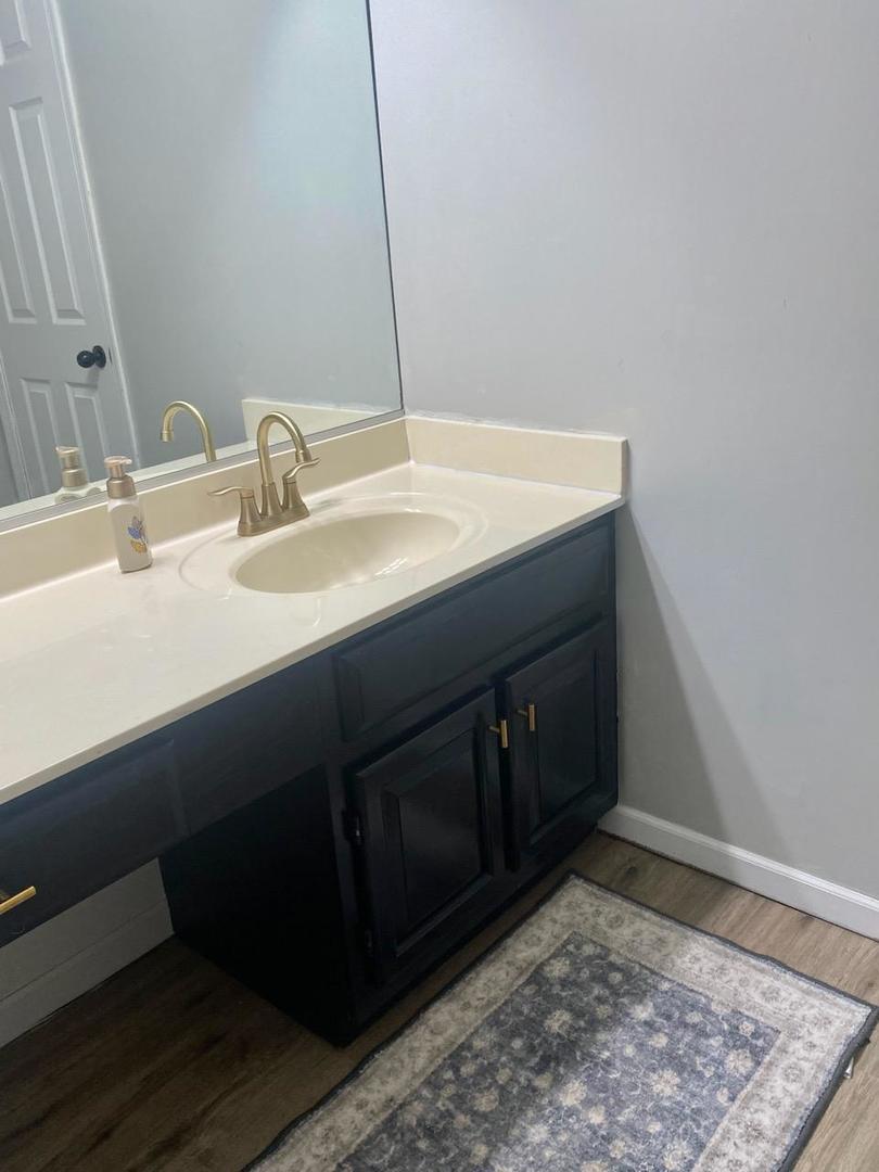 90 Decker Drive Cary, IL 60013 - Photo 5 of 12 a bathroom with a sink and a mirror